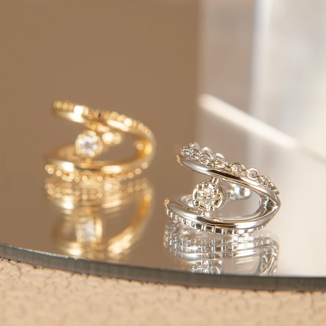 Cable and grid diamond ear cuff